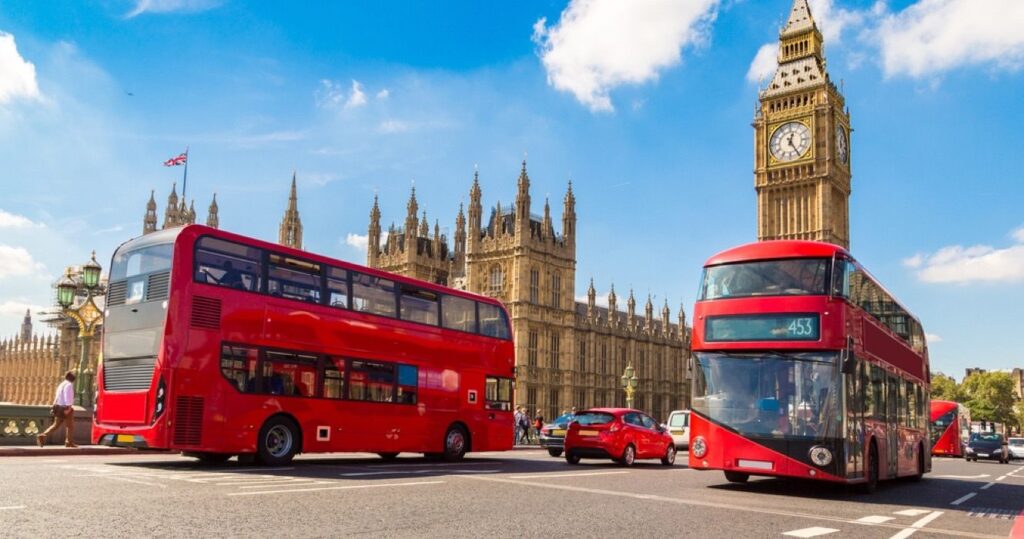 Red buses and Big Ben tower in England