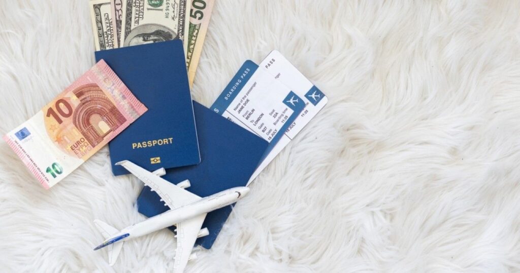 Travel concept, toy plane, passport, money