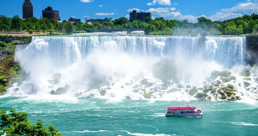 a boat sailing past niagara falls in canada