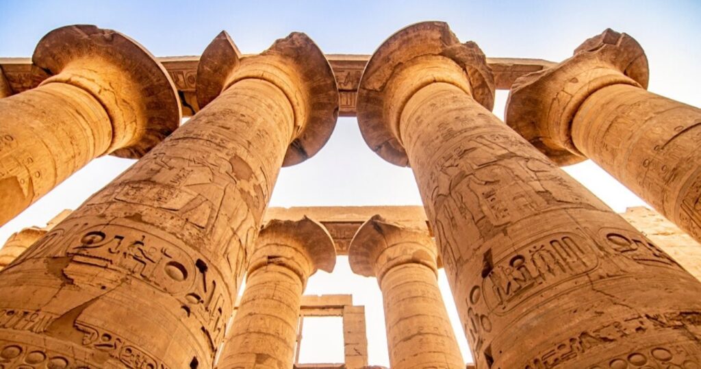ancient Egyptian pillars covered in hieroglyphics