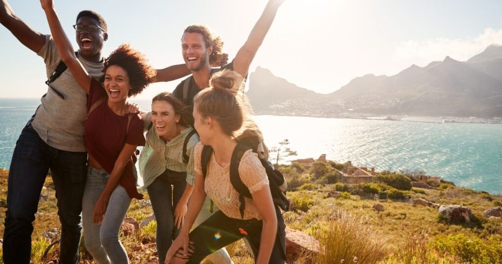 a group of friends taking a photo while hiking