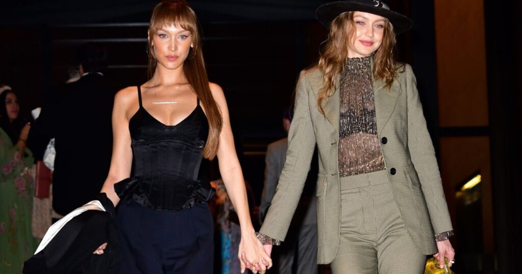 Bella and Gigi Hadid holding hands