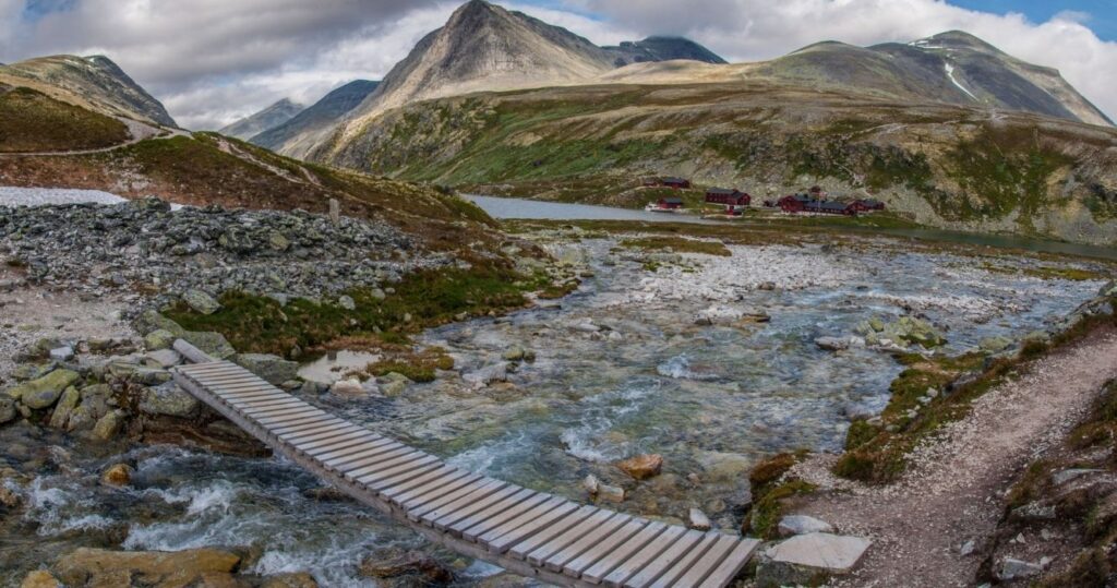 a bridge over a stream in rondane national park