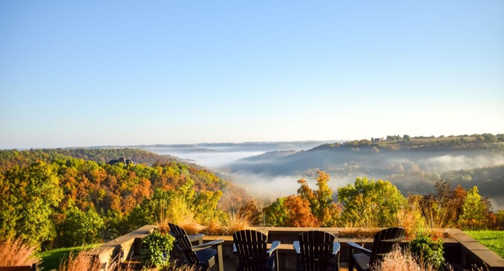 patio overlooks an Ozarks valley with fall foliage