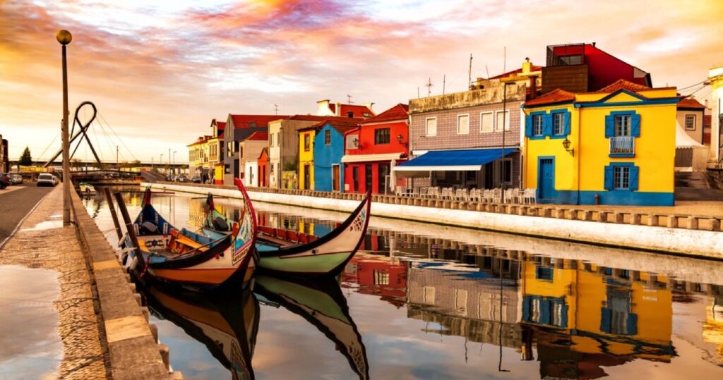 Traditional boats and historical buildings in Aveiro, Portugal